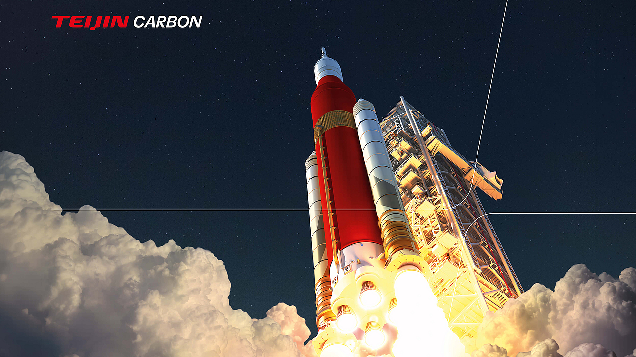 Eine Grafik auf einem Teijin Carbon Messestand zeigt die NASA Artemis SLS Rakete beim Abheben, umgeben von Rauchwolken. Das Teijin Carbon Logo ist oben links sichtbar.